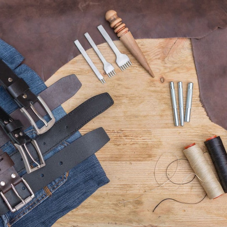 Tools needed for a team building, leather belt making activity