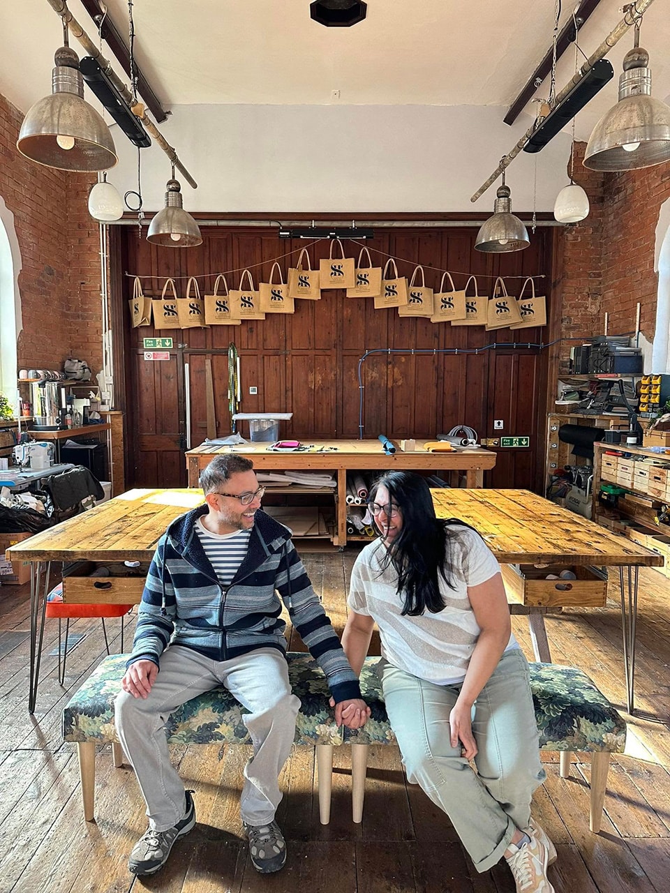 Sheila and Nehal enjoying a couples upholstery workshop in Cheshire, working together creating handcrafted benches
