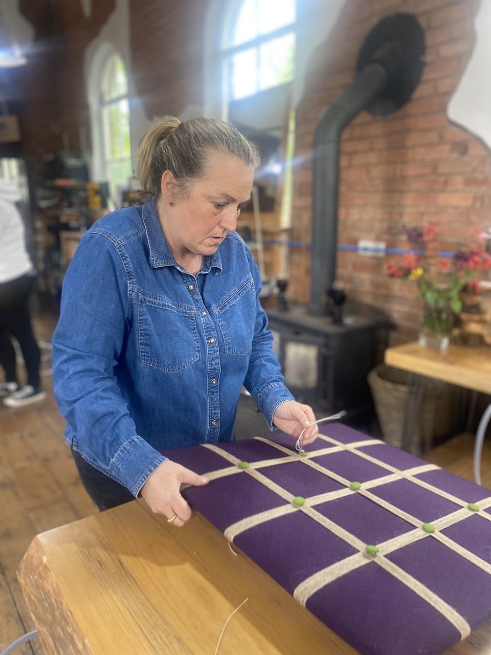 Jenny adding the buttons to her noticeboard