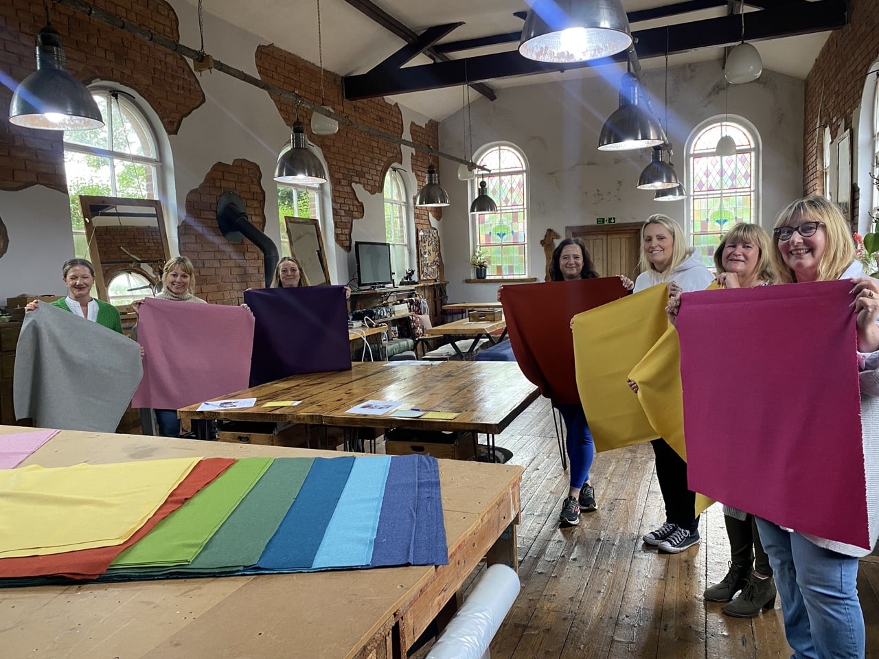 Jenny choosing her fabric at noticeboard upholstery workshop in Cheshire