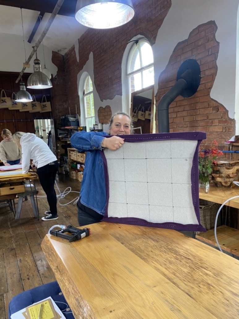Jenny making her noticeboard in purple fabric