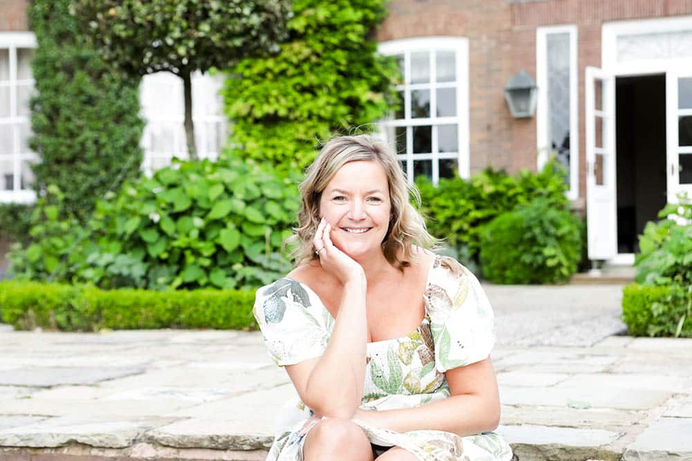 Emma Semper Hopkins sat outside in the garden at Delamere Manor Cheshire