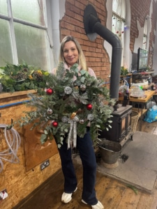Close-up of eco-friendly Christmas wreath made with fresh foliage during a wreath making class in Scholar Green