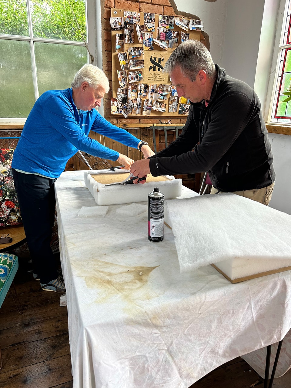 Corporate team bonding experience creating storage boxes in workshop setting