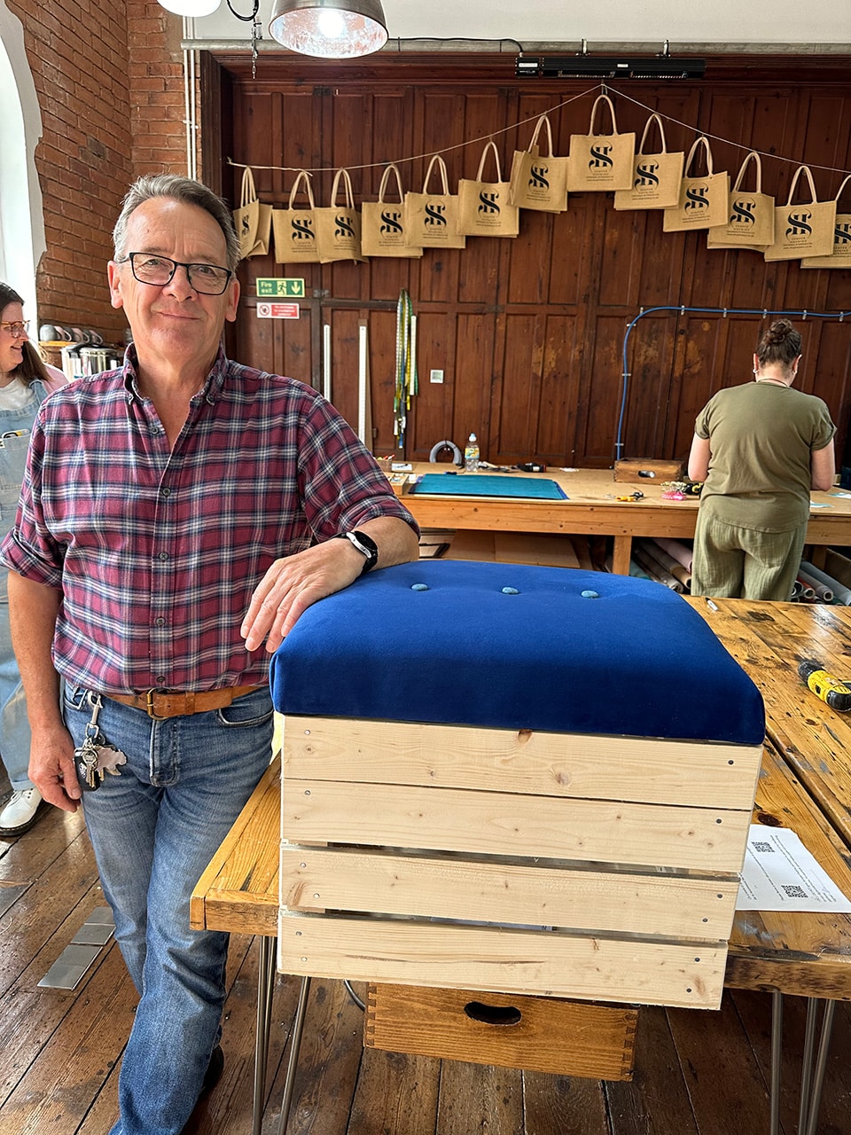 Corporate team bonding experience creating storage boxes