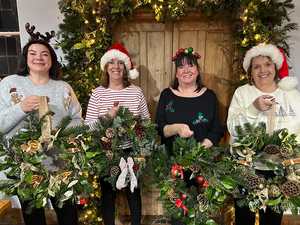 Participants enjoying wreath making workshops