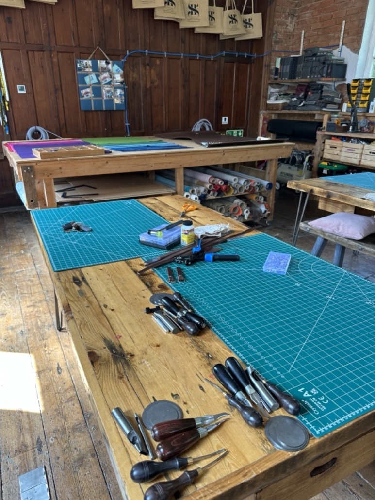 Craft workshops in Cheshire studio space set up for the leather belt making workshop, showing tools, materials, and equipment ready for participants to make your own leather belt.