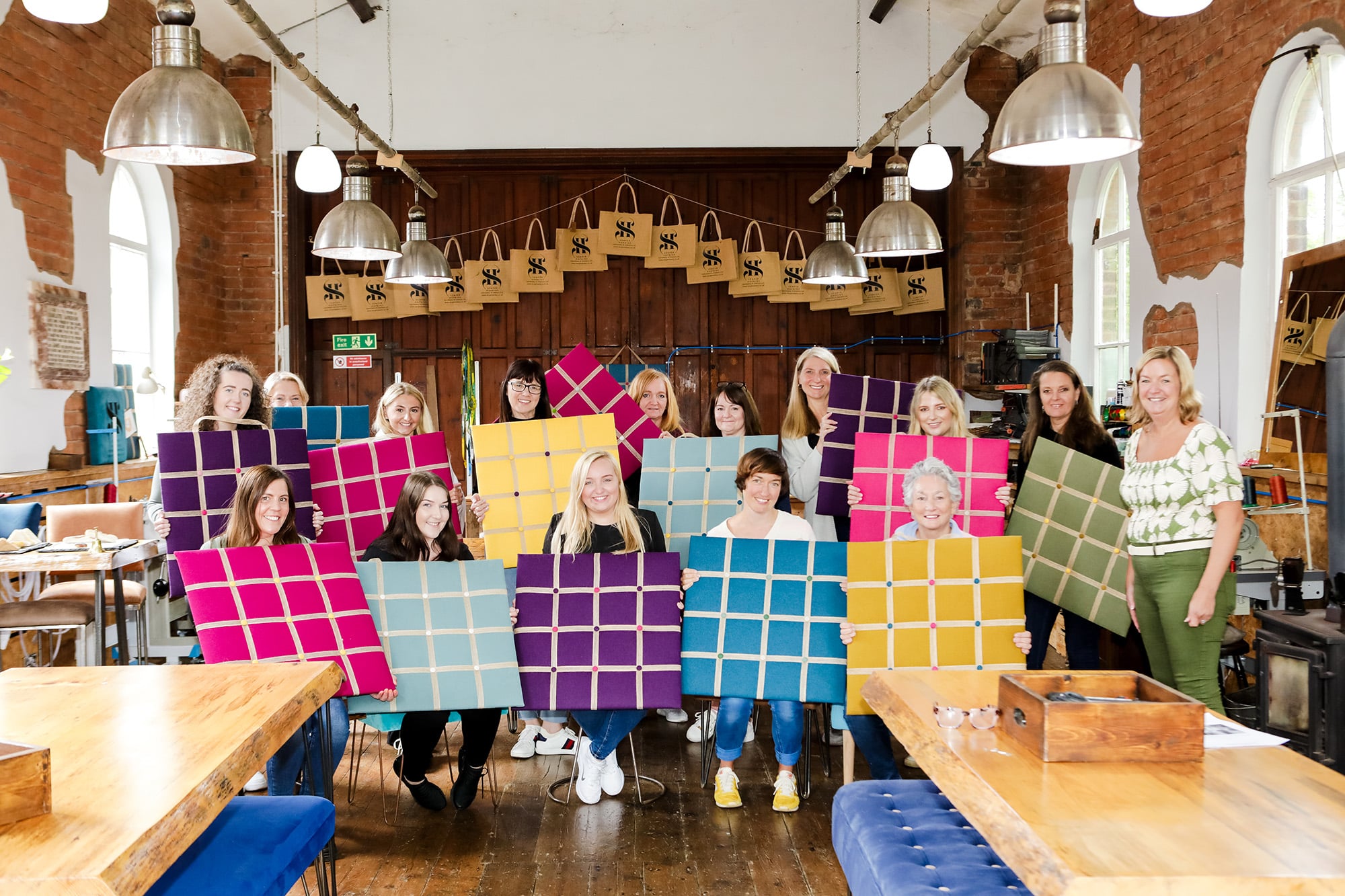 Sinclair Law team smiling at the end of their away day with their finished noticeboards