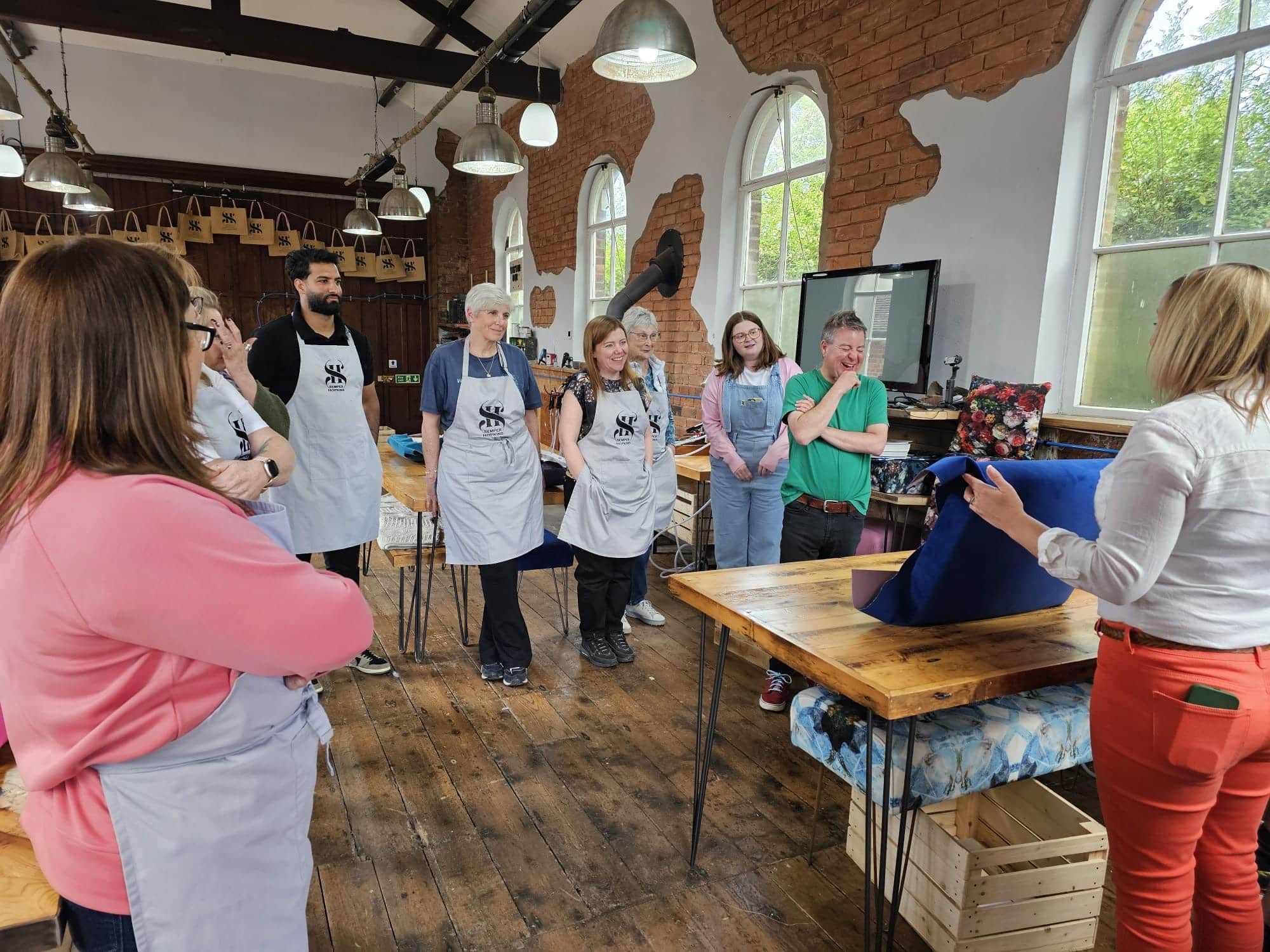 A group of ladies taking part in a noticeboard team building day
