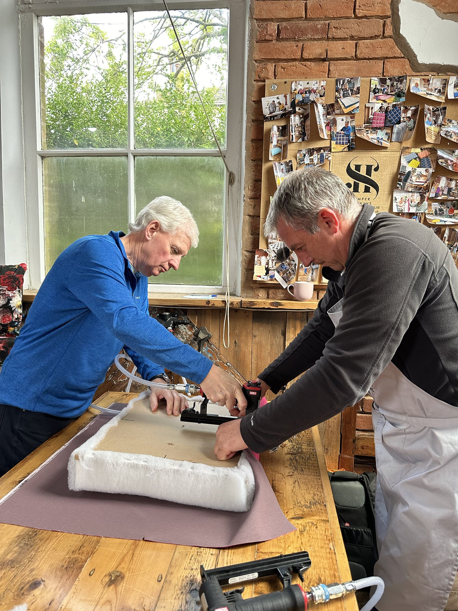 A group of ladies taking part in a noticeboard team building day