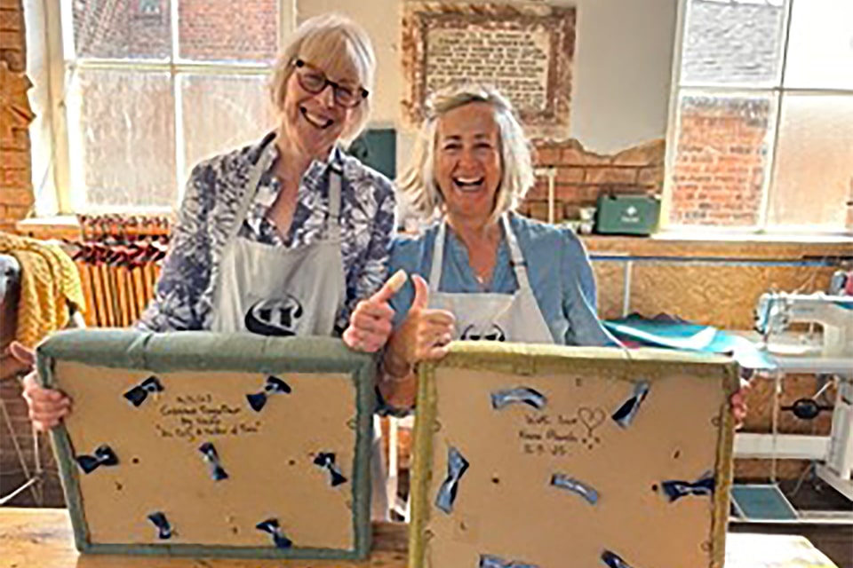 A group of friends enjoying a creative workshop experience, making their projects and sharing a relaxed, meaningful day together.