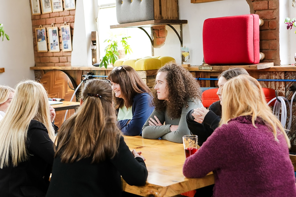 Team reflecting together during a facilitated afternoon to break down barriers