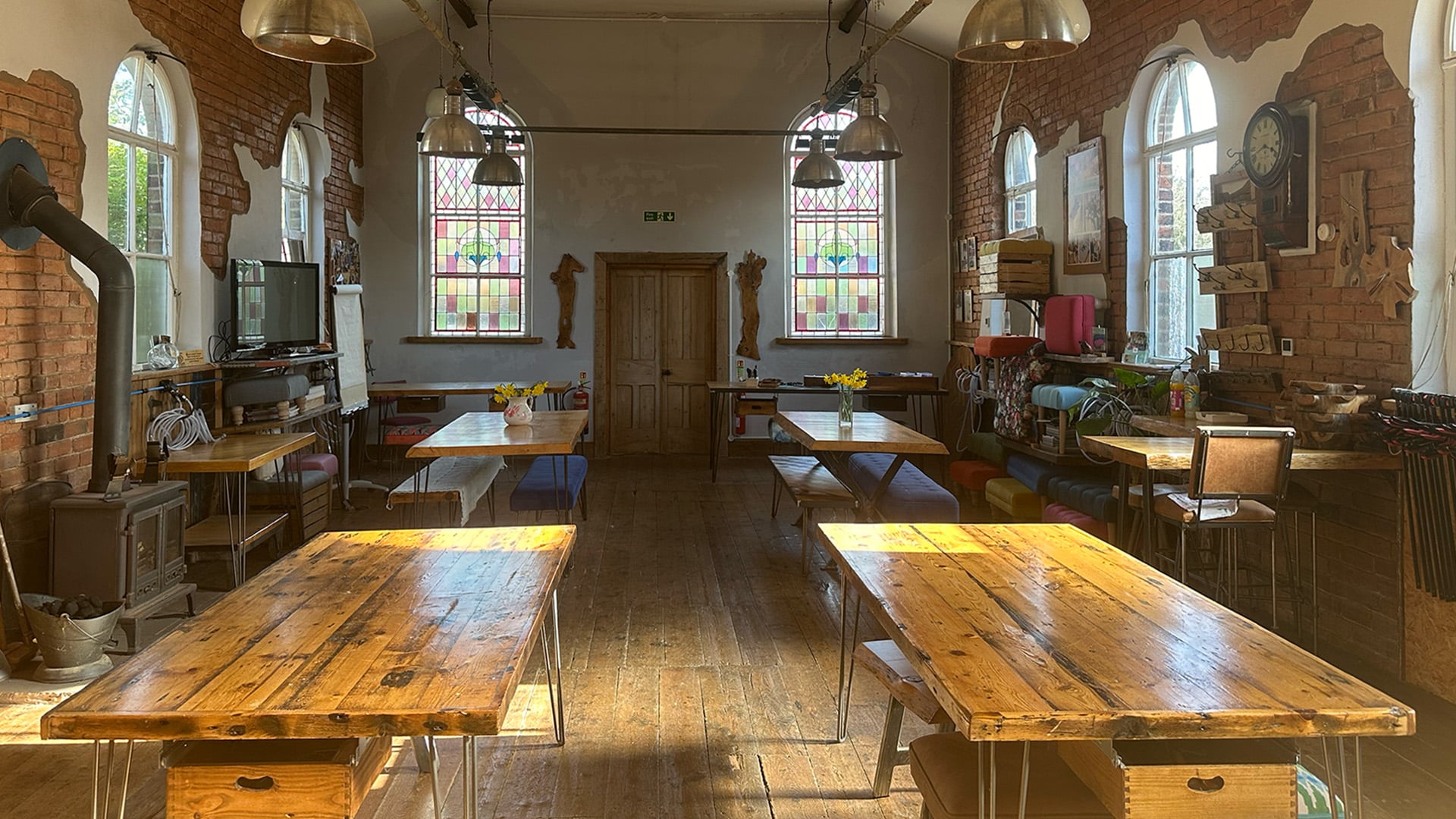 Interior of converted chapel workshop venue set up for small group sessions in Cheshire