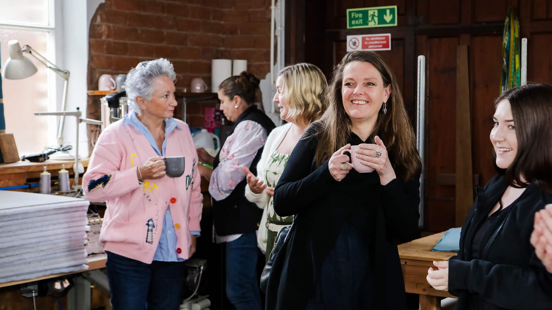 Guests arriving and chatting over coffee before workshop